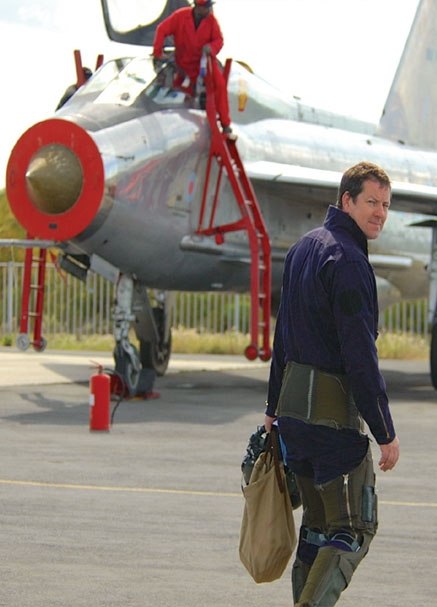 Ian Black in flight kit beside an English Electric Lightning